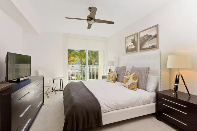 a view of a balcony with wooden floor and fence
