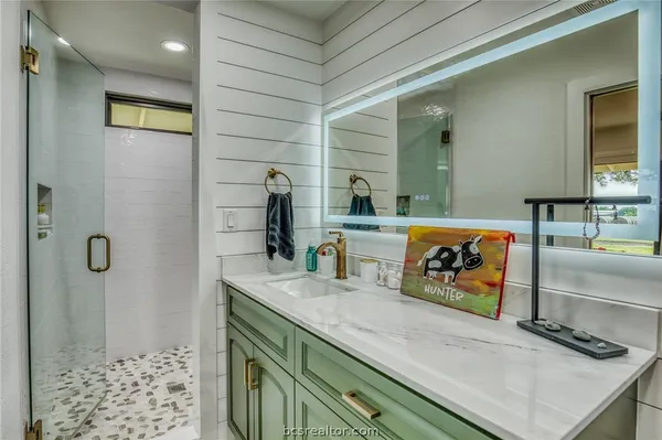 a bathroom with a sink and a mirror