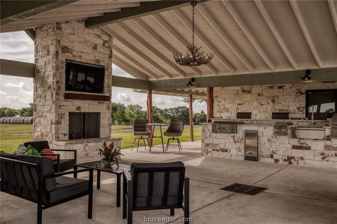 18581 William Penn Road Washington, TX 77880 - Photo 17 of 49 a living room with furniture and a fireplace