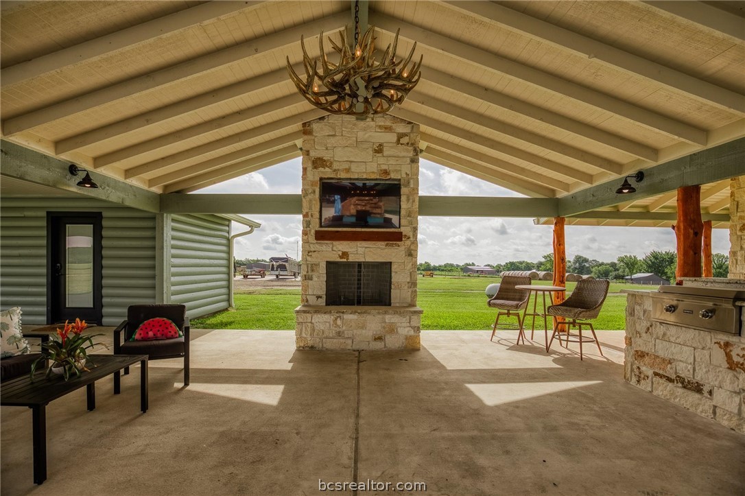 18581 William Penn Road Washington, TX 77880 - Photo 19 of 49 a view of a patio with a table chairs and a garden