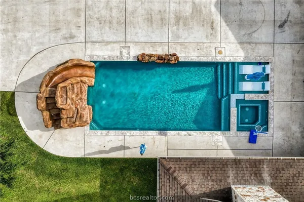 a view of a swimming pool with a garden