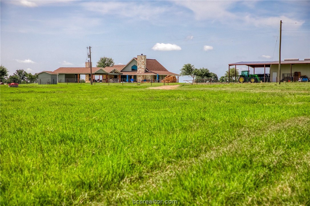 18581 William Penn Road Washington, TX 77880 - Photo 31 of 49 a view of a house with a yard and sitting area