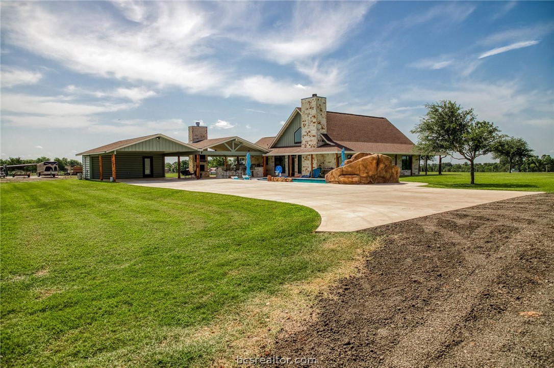 18581 William Penn Road Washington, TX 77880 - Photo 47 of 49 a view of a house with a big yard and large trees