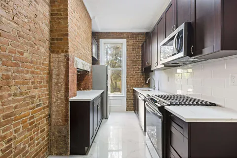 a kitchen with a stove and a sink