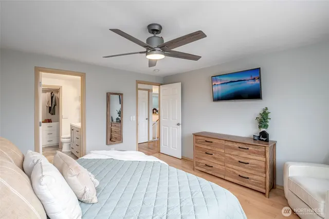 a bedroom with a bed and a dresser