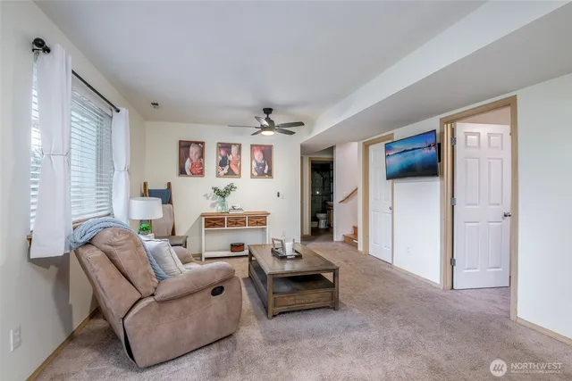 a view of a house with a big yard and large trees