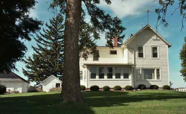 5138 Oakville Road Chadwick, IL 61014 - Photo 1 of 9 a front view of a house with a yard