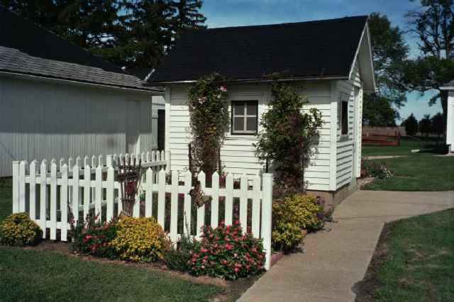 5138 Oakville Road Chadwick, IL 61014 - Photo 2 of 9 a front view of a house with a garden