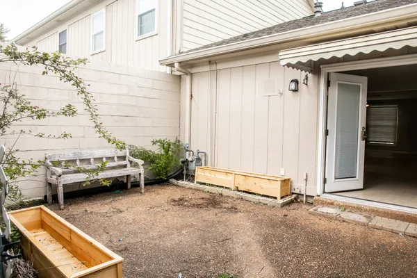 a view of a backyard with sitting area
