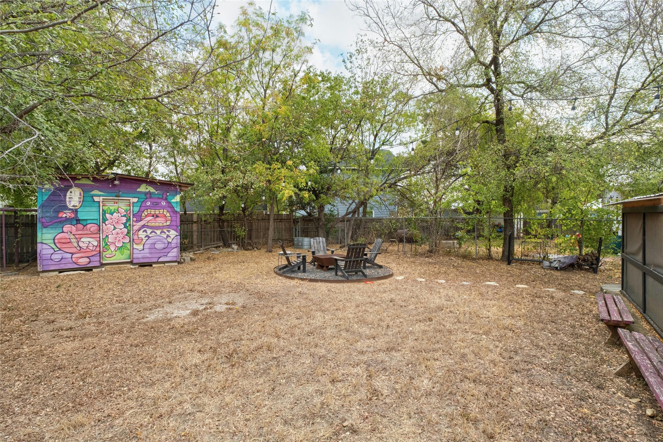 2804 Crest Avenue Austin, TX 78702 - Photo 14 of 16 a view of backyard with a table and chair