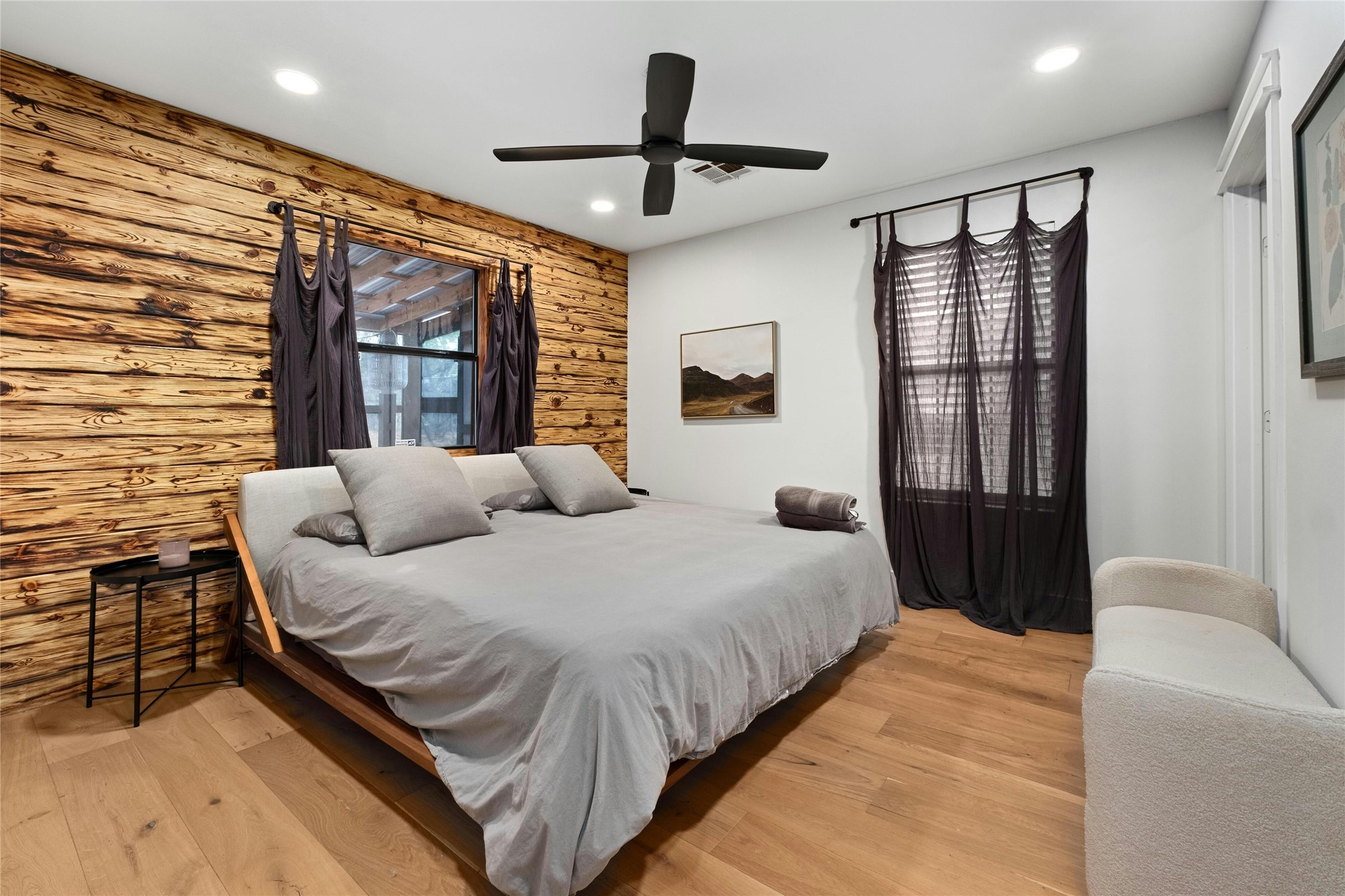 2804 Crest Avenue Austin, TX 78702 - Photo 7 of 16 a bedroom with a large bed and a large window