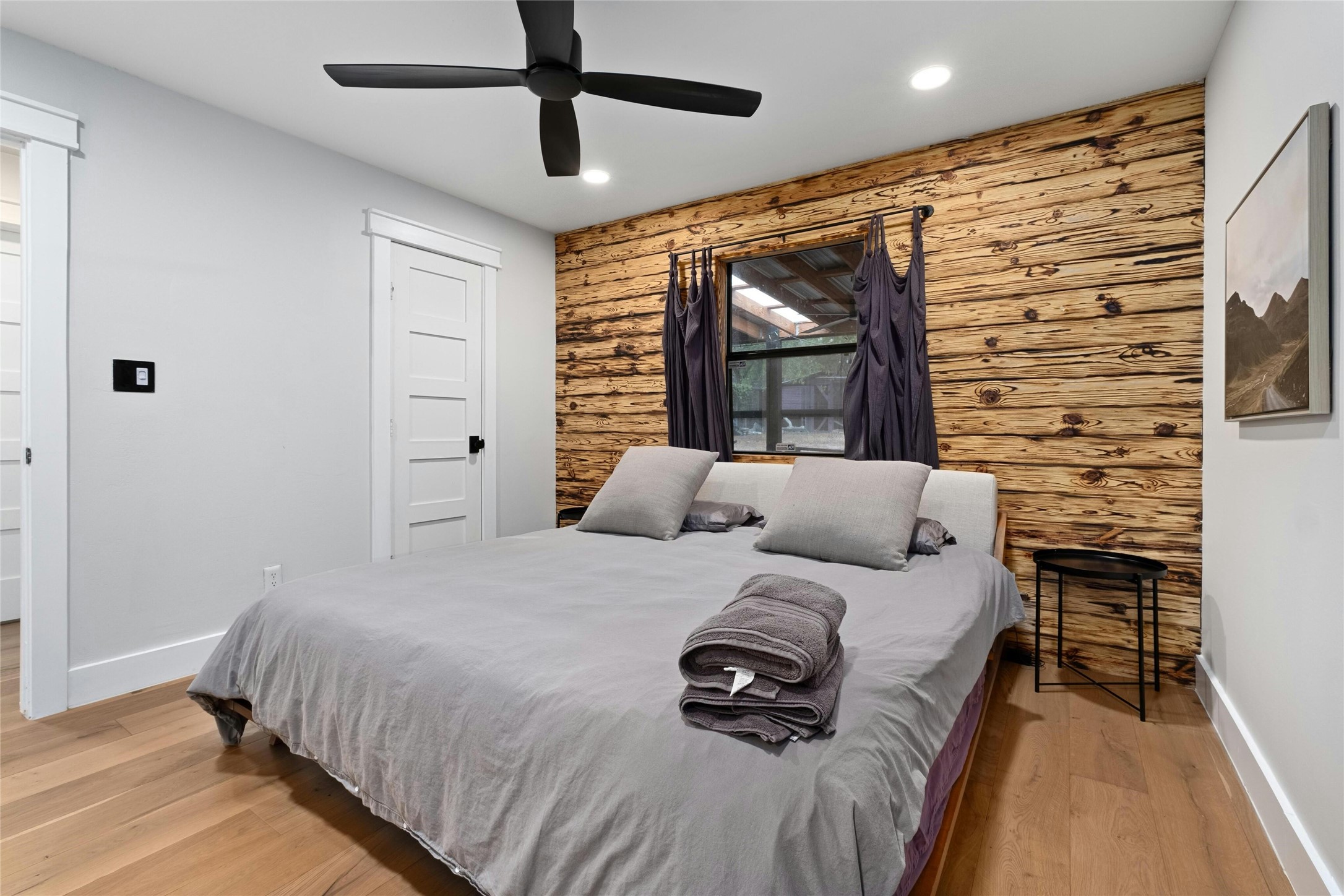 2804 Crest Avenue Austin, TX 78702 - Photo 8 of 16 a bedroom with a bed window and a ceiling fan