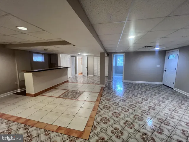 a view of a hallway with seating area