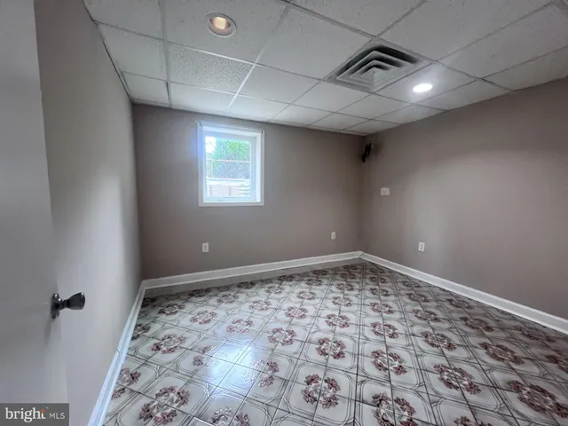 a view of an empty room and window