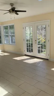 a view of empty room with windows