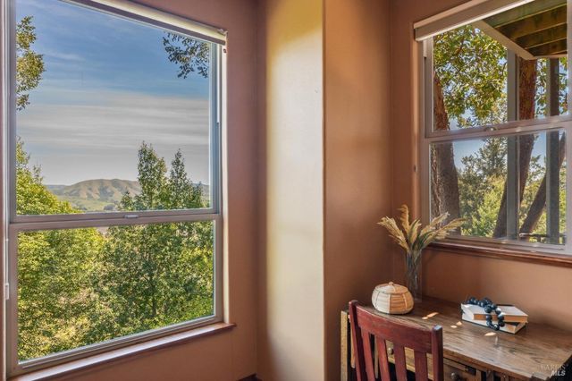 a view of a balcony with furniture