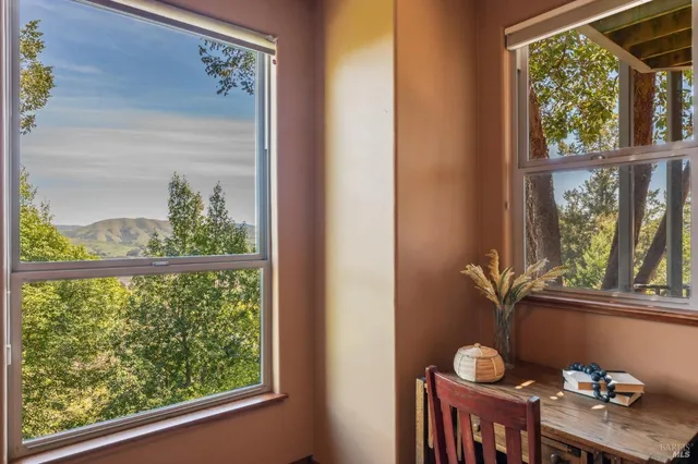 a view of a balcony with furniture