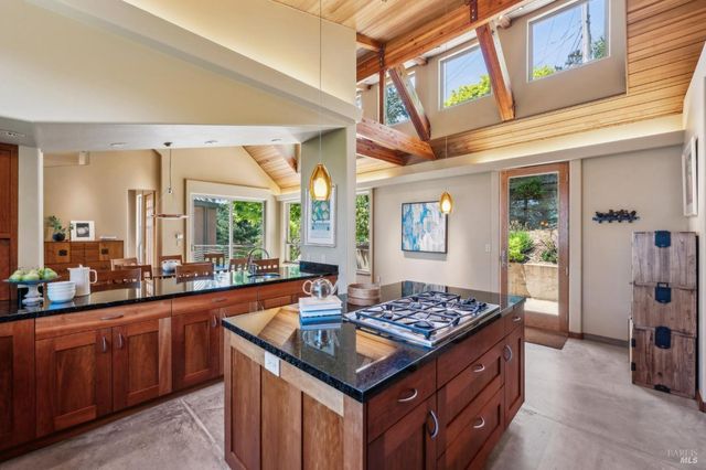 a kitchen with a stove a sink and a refrigerator