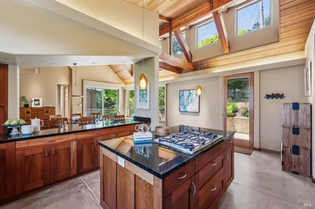 a kitchen with a stove a sink and a refrigerator