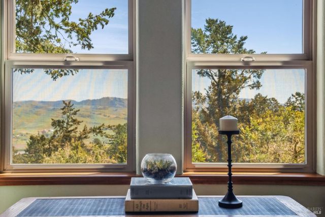 a room with wooden floor and a window