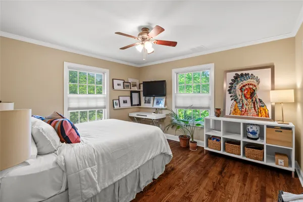 a bedroom with a bed and a bookshelf