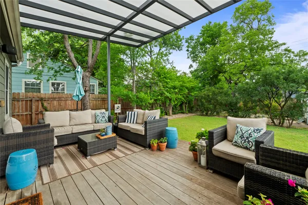 a balcony with furniture and garden view