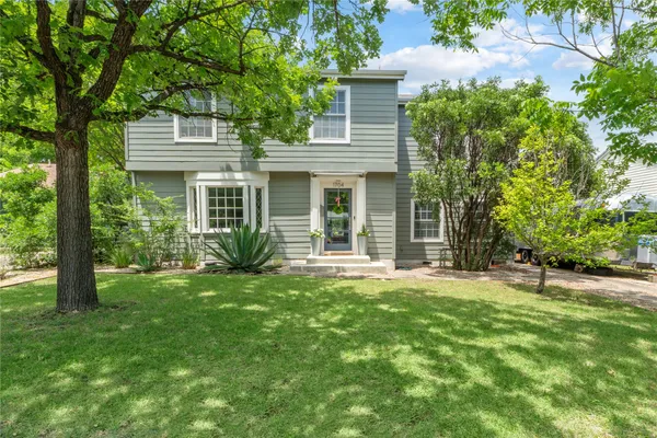 front view of a house with a yard