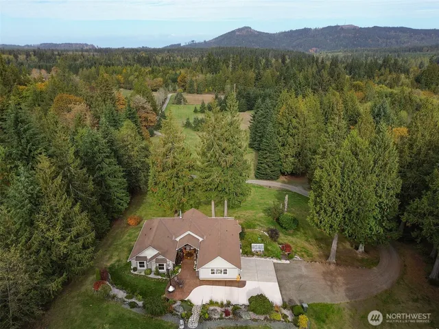 a view of house with a yard
