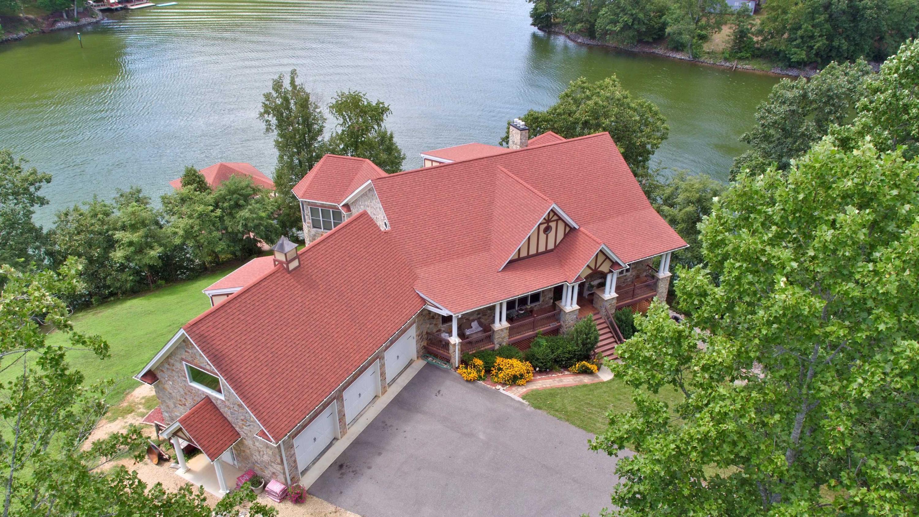 1256 Moon Ridge Lane Goodview, VA 24095 - Photo 1 of 1 an aerial view of a house with outdoor space and lake view