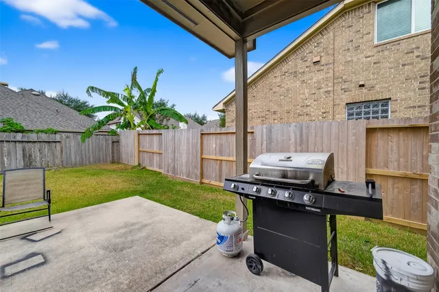 a view of a backyard with a tub