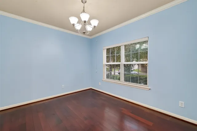 a view of a brick house with a large windows