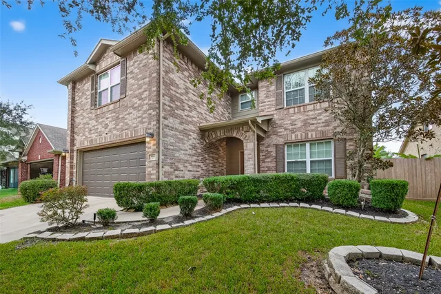 a view of a house with a yard and plants