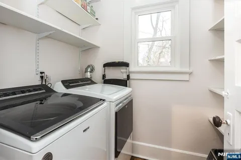 a view of a sink and a microwave
