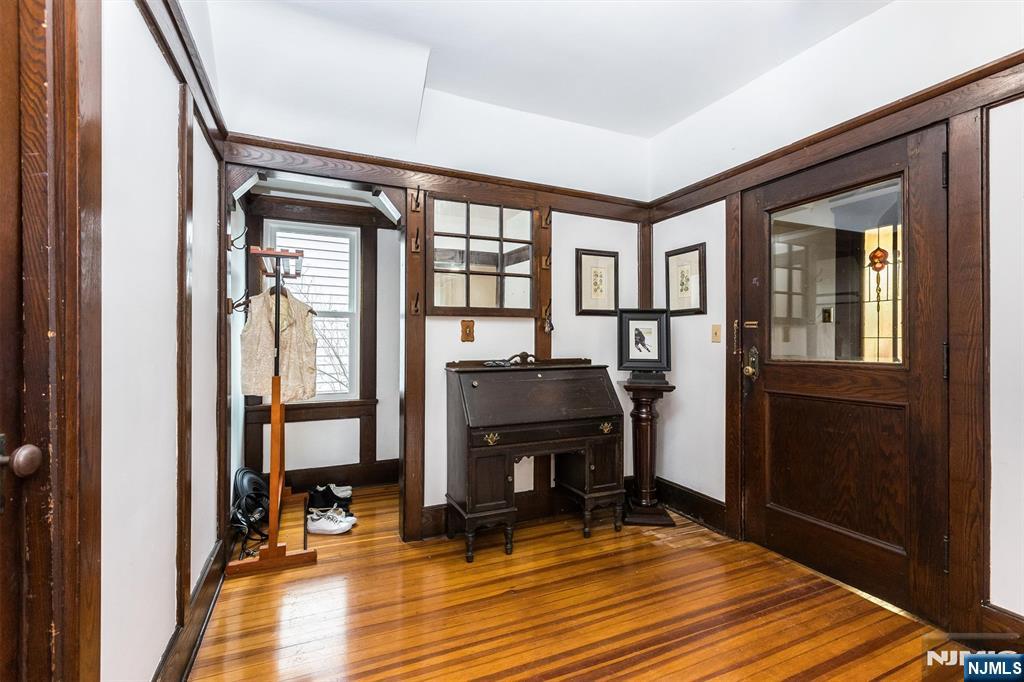 56 Walnut Crescent, Unit 1 Montclair, NJ 07042 - Photo 3 of 18 a view of livingroom with furniture and a fireplace