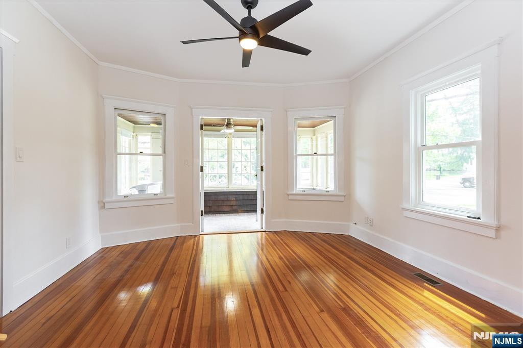 56 Walnut Crescent, Unit 1 Montclair, NJ 07042 - Photo 4 of 18 a view of empty room with wooden floor and fan