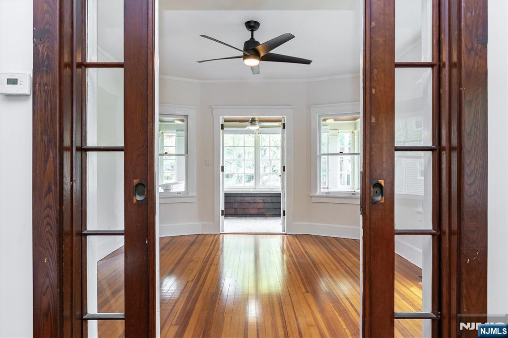 56 Walnut Crescent, Unit 1 Montclair, NJ 07042 - Photo 6 of 18 a view of empty room with a window and wooden floor