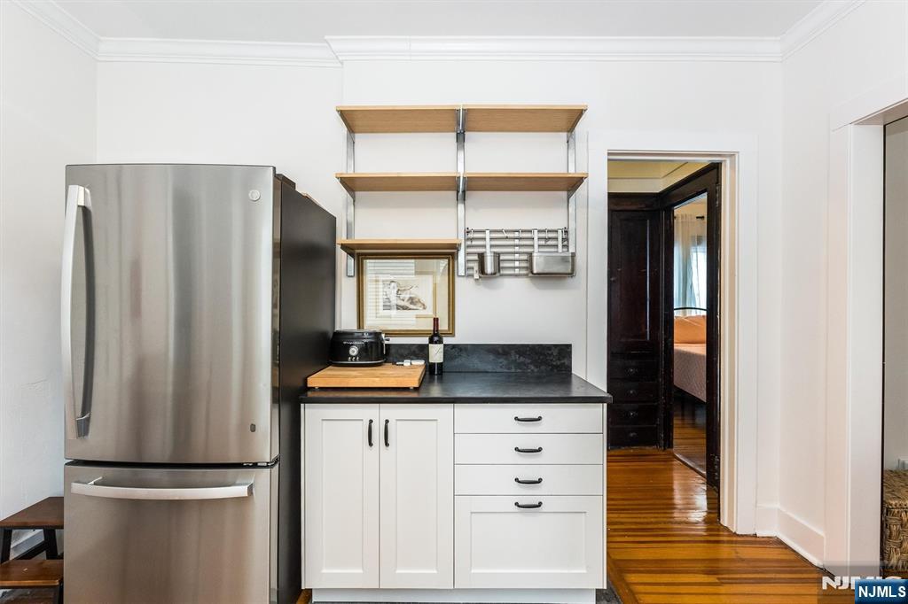 56 Walnut Crescent, Unit 1 Montclair, NJ 07042 - Photo 10 of 18 a kitchen with stainless steel appliances granite countertop a refrigerator and a sink