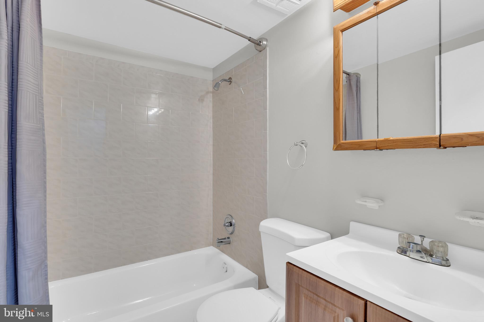 11620 Vantage Hill Road, Unit 22B Reston, VA 20190 - Photo 21 of 24 a bathroom with a sink toilet and shower