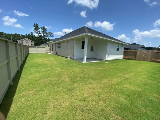 a big room with yard and entertaining space