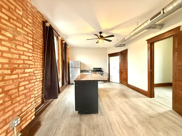 a view of a living room and a kitchen