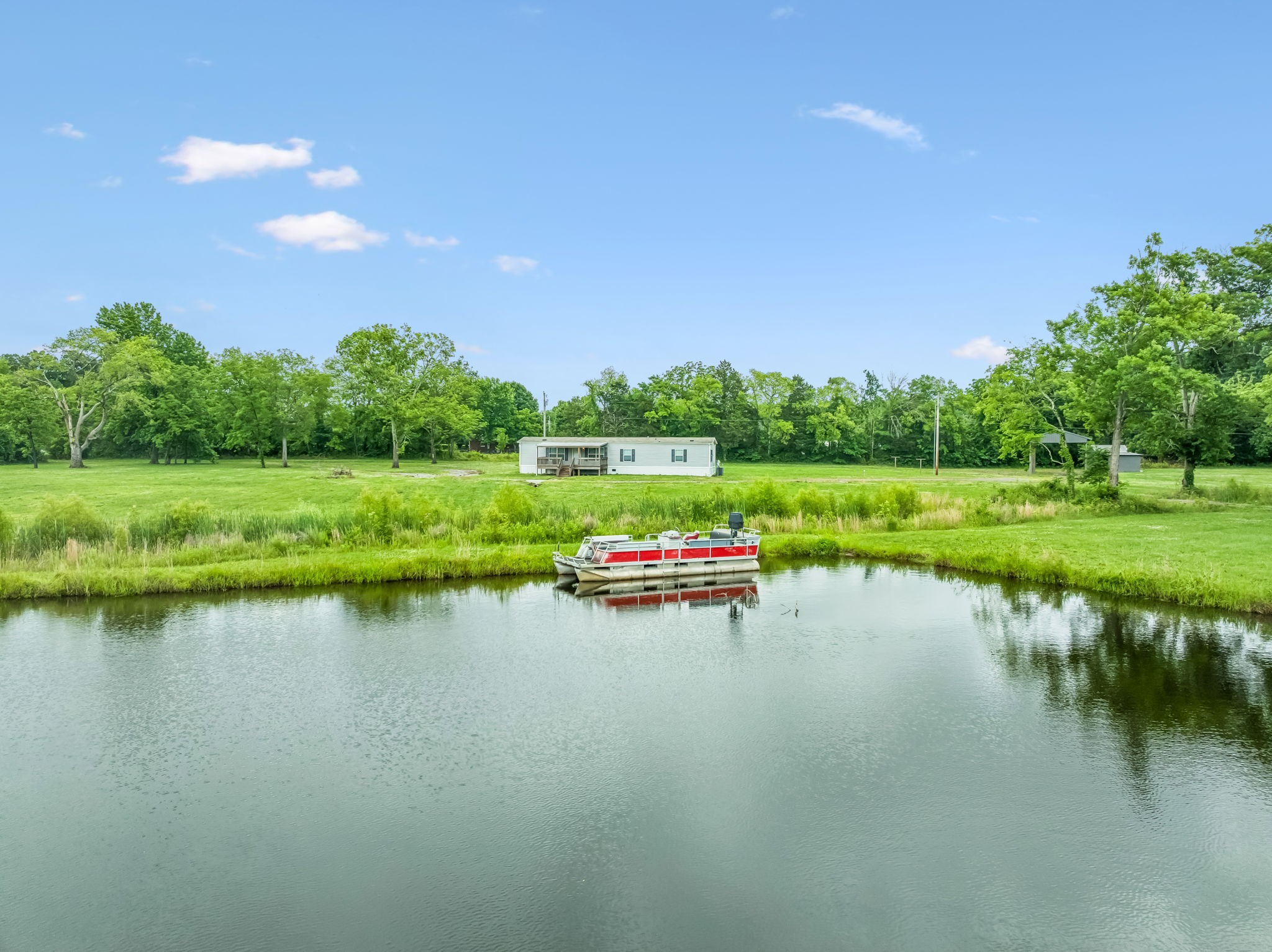 280 Kingdom Road Unionville, TN 37180 - Photo 42 of 65 a view of a lake with houses in the back