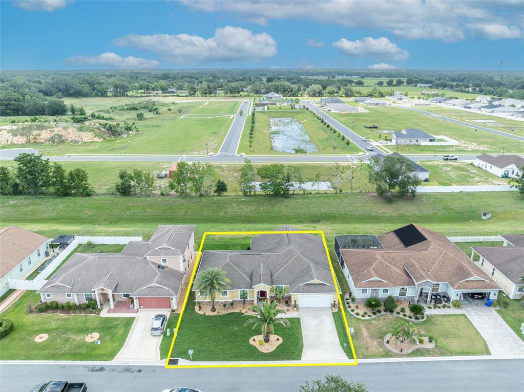 4946 Northeast 124th Road Oxford, FL 34484 - Photo 60 of 69 an aerial view of a house with big yard