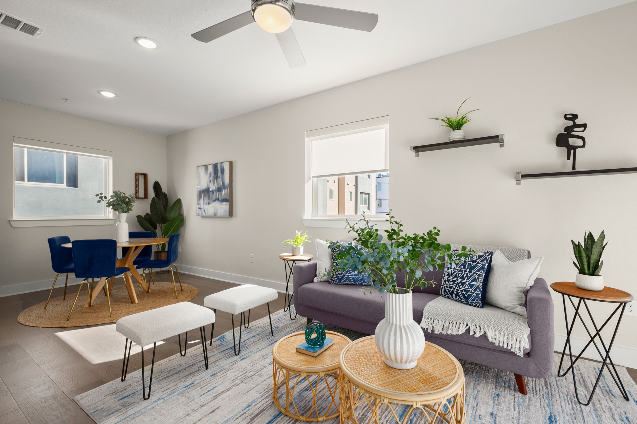 2827 Manor Road, Unit 3105 Austin, TX 78722 - Photo 12 of 26 a living room with furniture and a potted plant