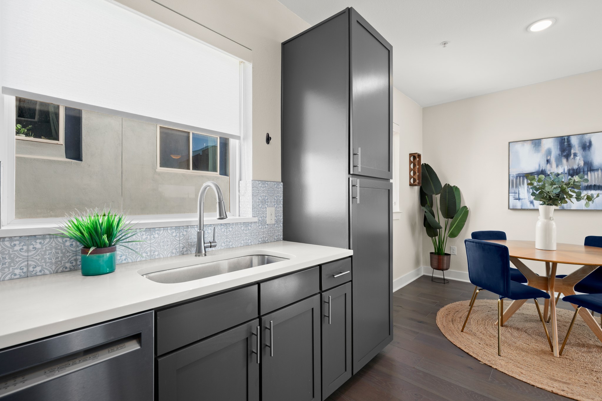 2827 Manor Road, Unit 3105 Austin, TX 78722 - Photo 17 of 26 a spacious bathroom with a granite countertop sink and a mirror