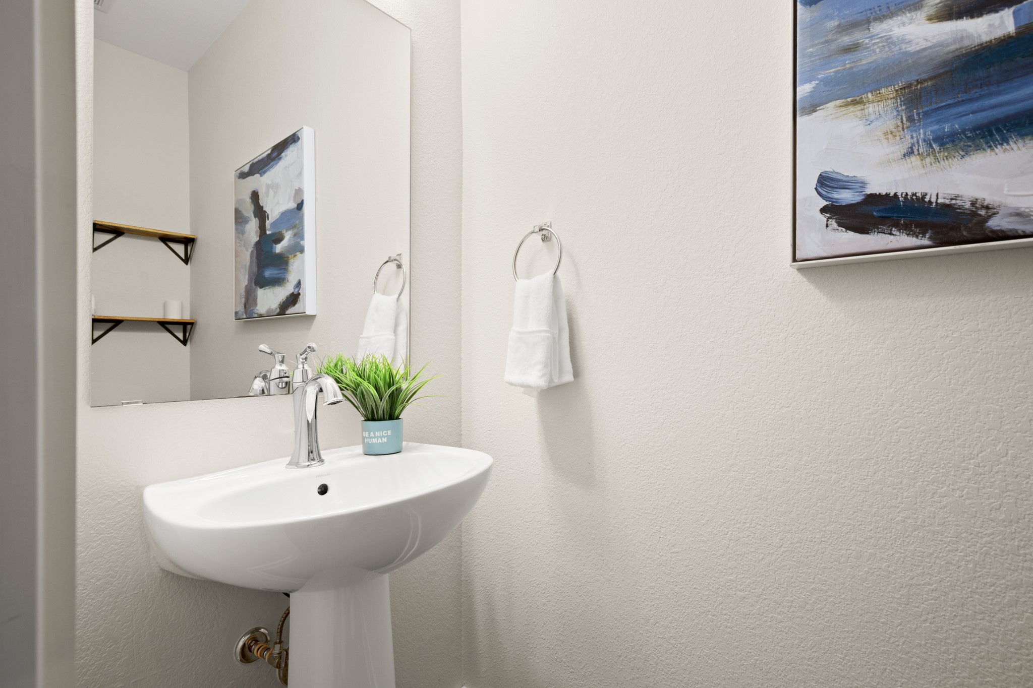 2827 Manor Road, Unit 3105 Austin, TX 78722 - Photo 22 of 26 a bathroom with a sink and a mirror