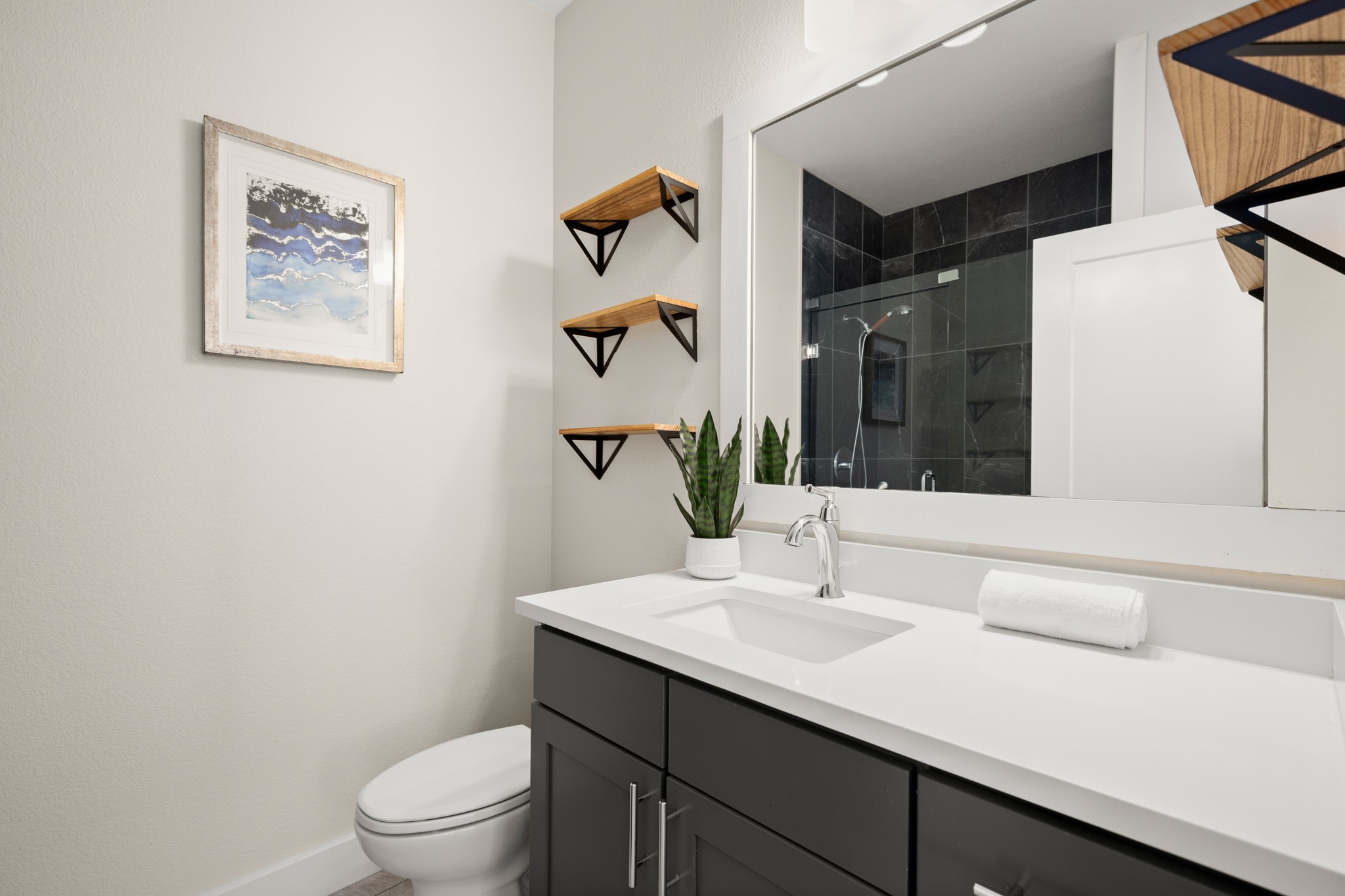 2827 Manor Road, Unit 3105 Austin, TX 78722 - Photo 7 of 26 a bathroom with a sink vanity and toilet