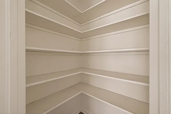 a view of an empty walk in closet