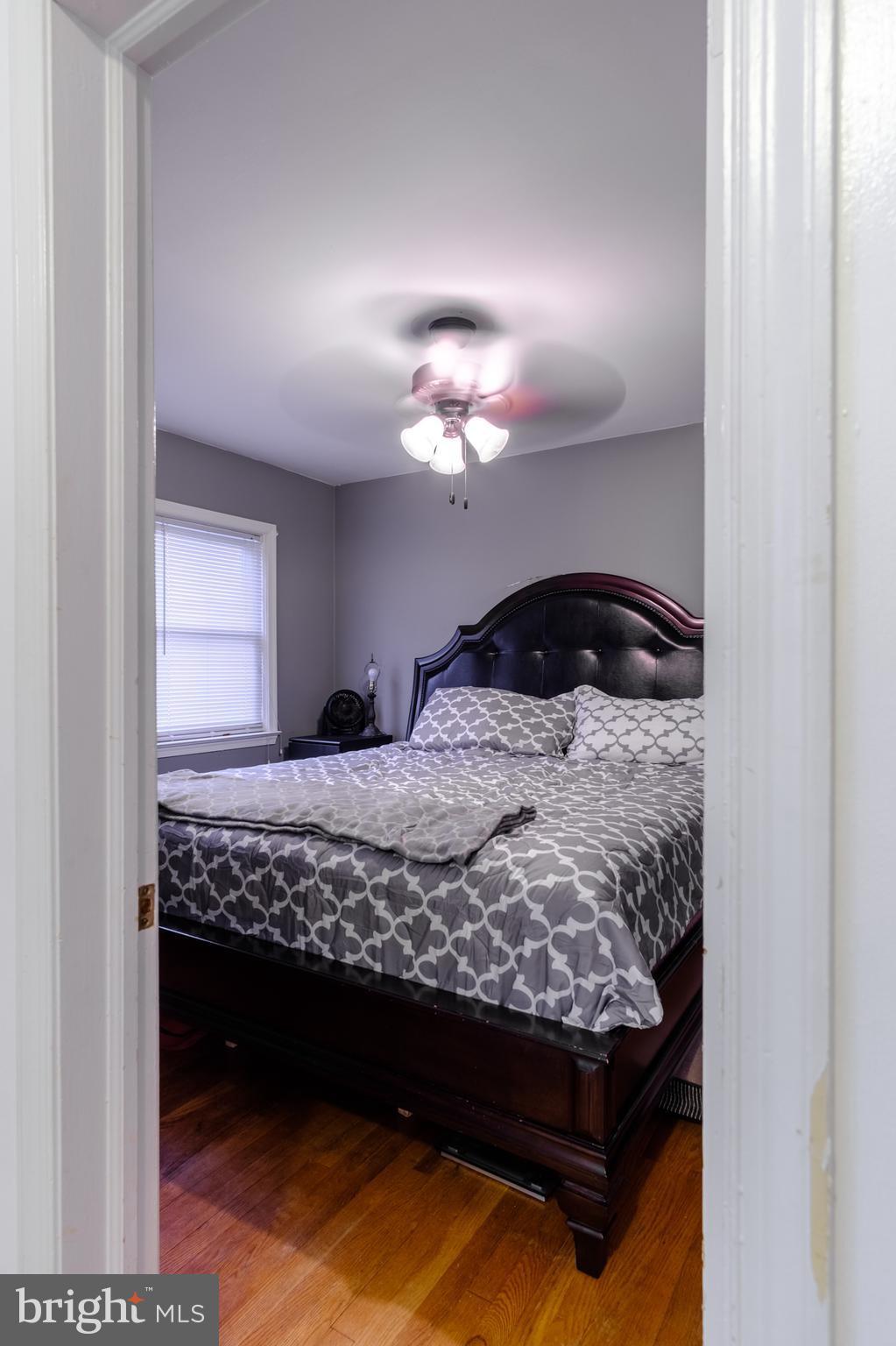1064 Downton Road Halethorpe, MD 21227 - Photo 22 of 29 a bedroom with a bed and a cabinets