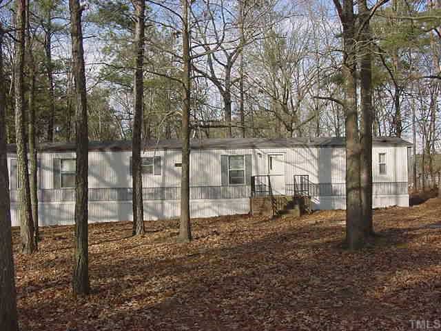 759 Silas Moore Road Coats, NC 27521 - Photo 1 of 1 a view of a tiny house with a yard