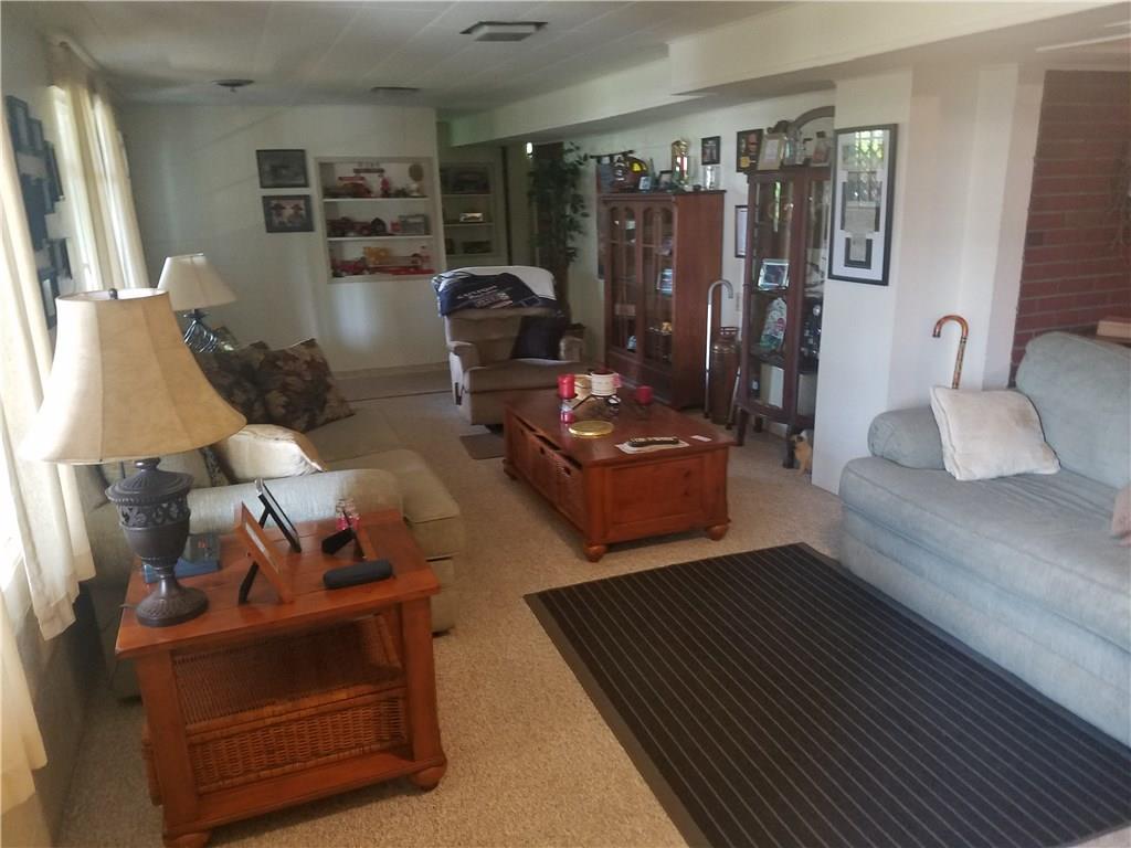 711 Spring Street Mars, PA 16046 - Photo 14 of 17 Another view of the very large Family Room! With Plenty of natural light! Additional room off family space tht is currently being used for storage but would make a nice den, office or playroom!